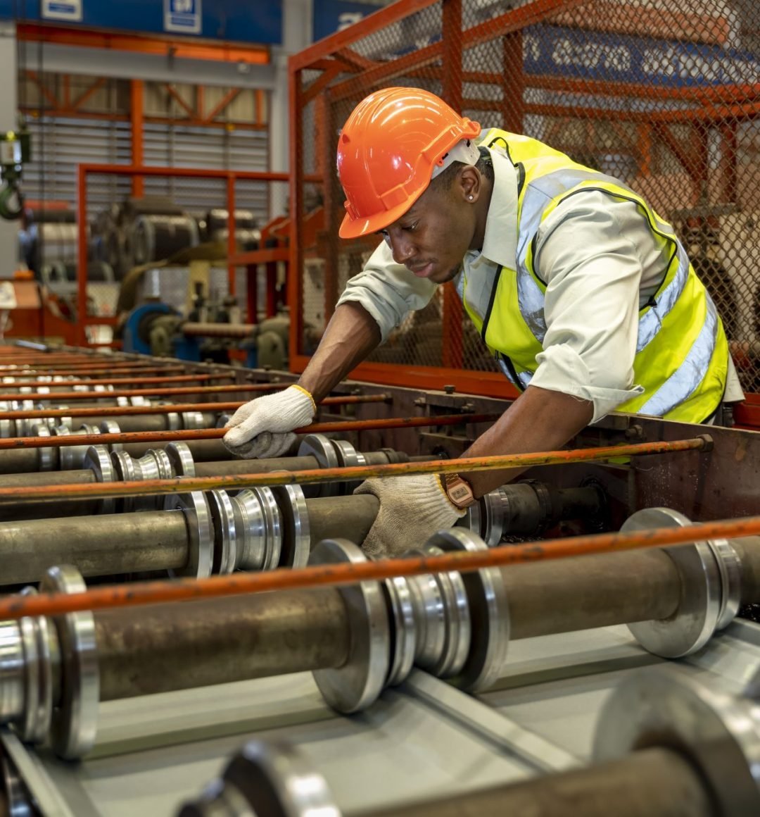 vecteezy_african-american-industrial-worker-is-checking-the-setup_8016891-2048x1365